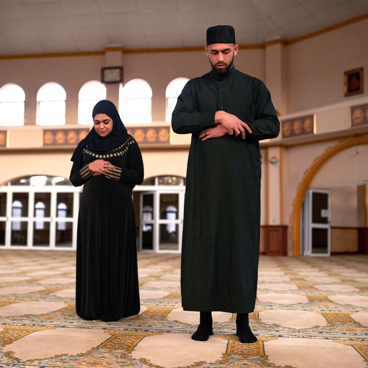 Muslim Man and Woman Praying Together